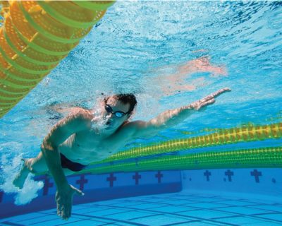 Man Swimming in Colorado Athletic Club - Boulder's Indoor Pool