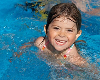 Young Girl Taking a Swimming Lesson | Colorado Athletic Club - Boulder