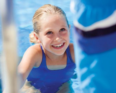 Girl in Our Outdoor Swimming Pool | Colorado Athletic Club - Boulder