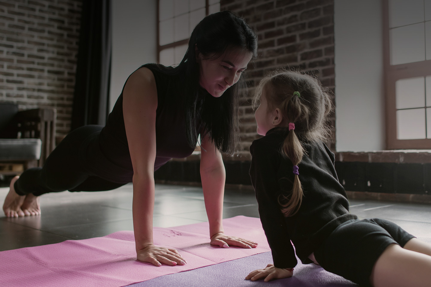 family fitness dad and daughter doing yoga