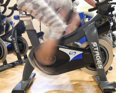 An Indoor Spinning Class at Wellbridge Athletic Club in Denver, CO