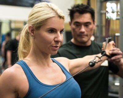 A Personal Trainer Training a Woman at Wellbridge Athletic Club in Denver, CO