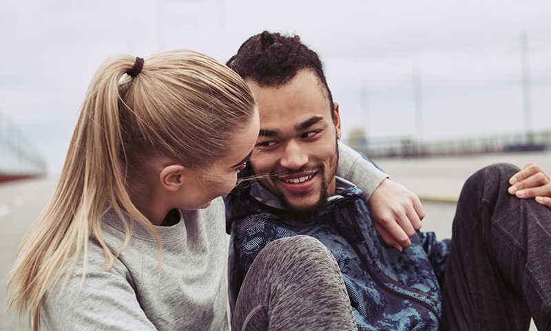 A couple looking at each other and smiling