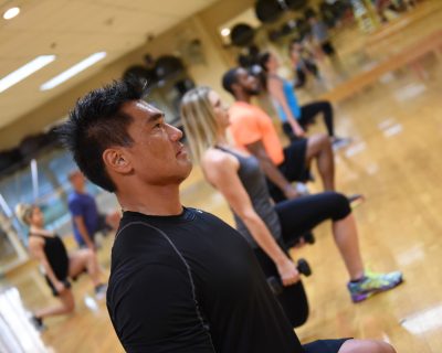 Group Fitness Class Doing Weighted Lunges | Colorado Athletic Club - Flatirons