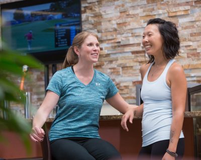 Two Friends Talking at a Networking Event | Colorado Athletic Club - Flatirons