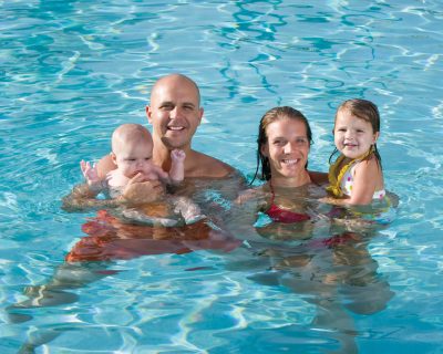 Family in the Swimming Pool at Colorado Athletic Club - Flatirons | Child Friendly Gym
