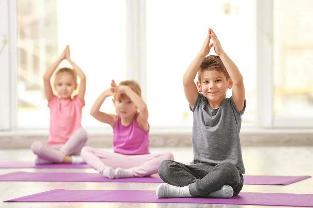 A group of kids doing yoga at Colorado Athletic Club