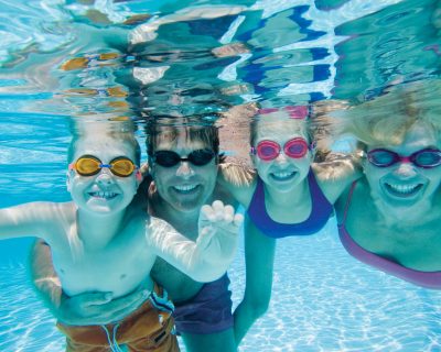 Family With Children Playing in the Pool | Colorado Athletic Club - Monaco | Family Friendly Gym