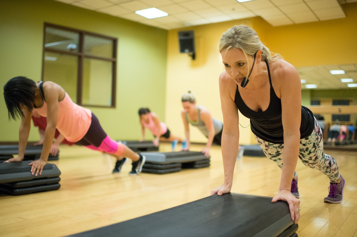Instructor Leading Class in Push Ups | Colorado Athletic Club - Flatirons
