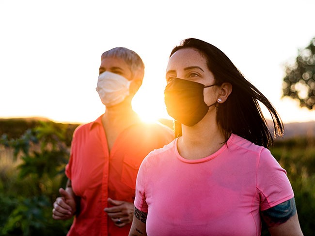 Running in sunrise with safety mask,CO