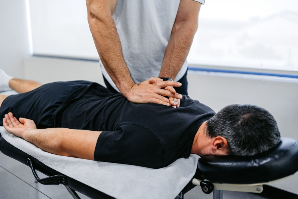 Man utilizing massage therapy for workout recovery