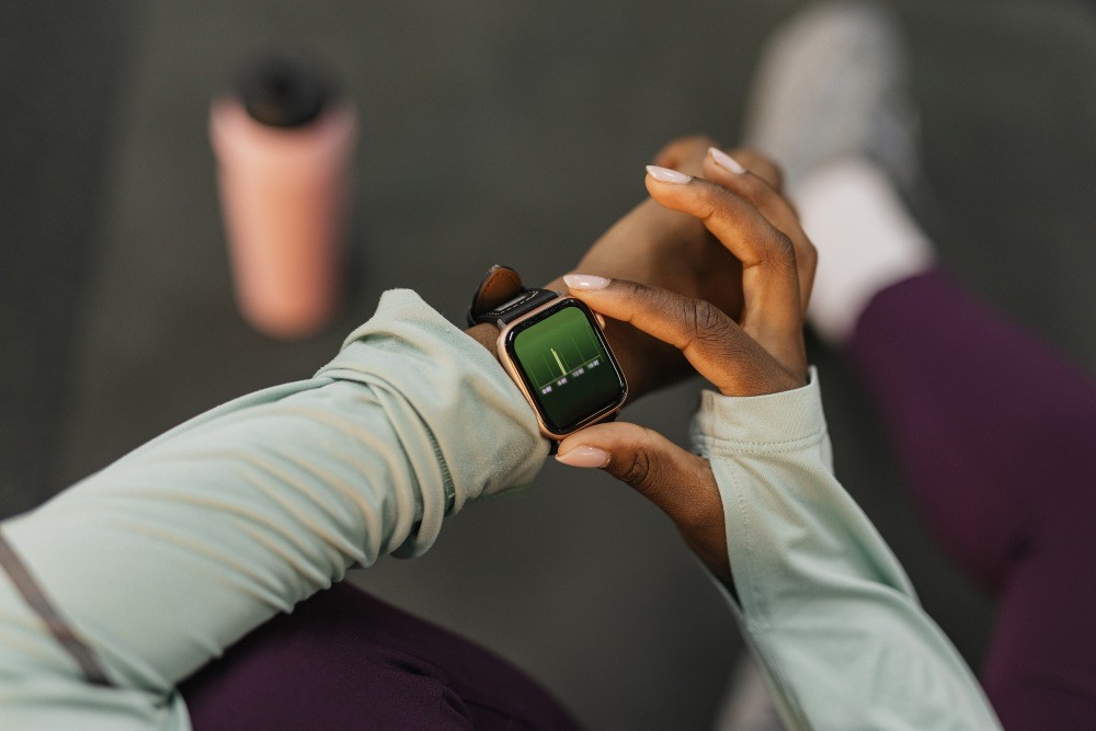 Woman checking her heart rate during workout.