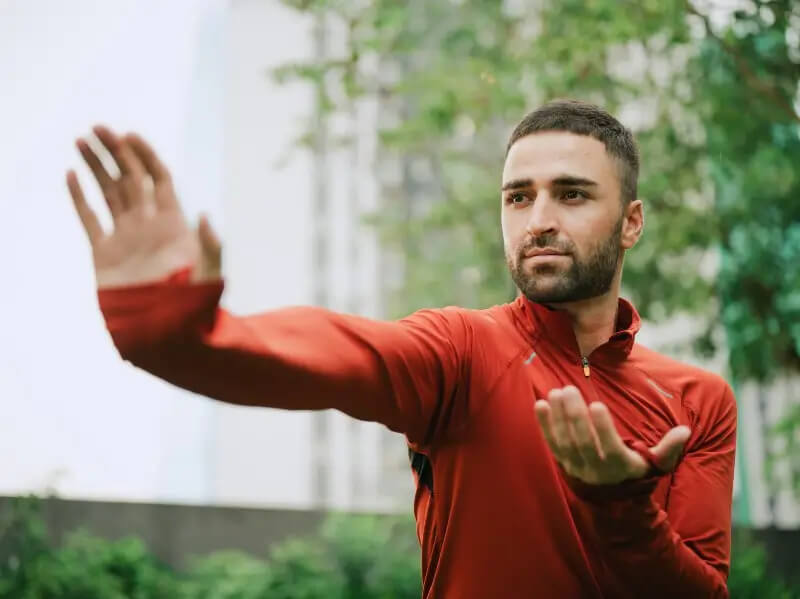 Man practicing tai chi to help lower stress levels